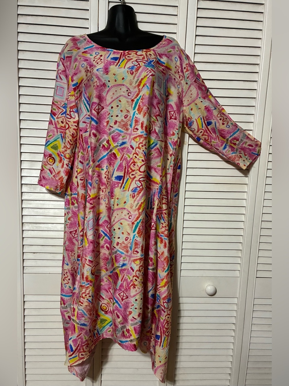 SHANA Multicolor Abstract Print Pink Tunic Dress with a sharkbite hem.